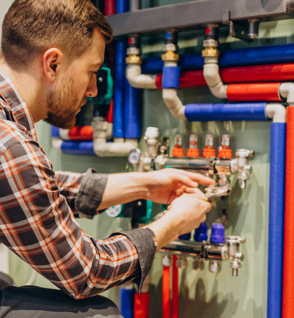 A man repairing water heater